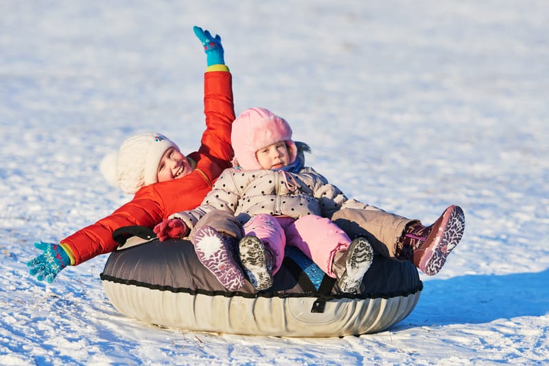 Children Tubing in the Winter